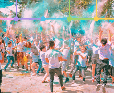 People engaging at holi event with graphical overlay if six colored logos